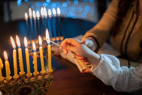 Jewish Holiday Chanukah/hanukkah Family Selebration. Jewish Festival Of Lights. Children Lighting Candles On Traditional Menorah Over Glitter Shiny Background